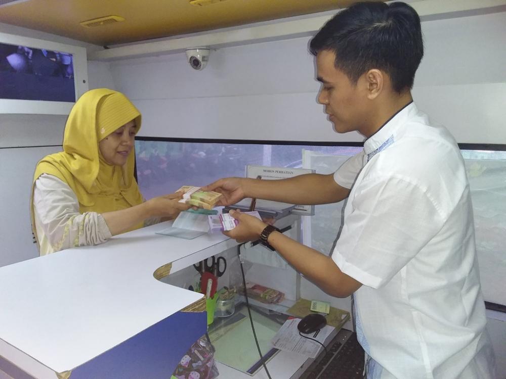 Mobil Kas Keliling Siap Layani Penukaran Uang